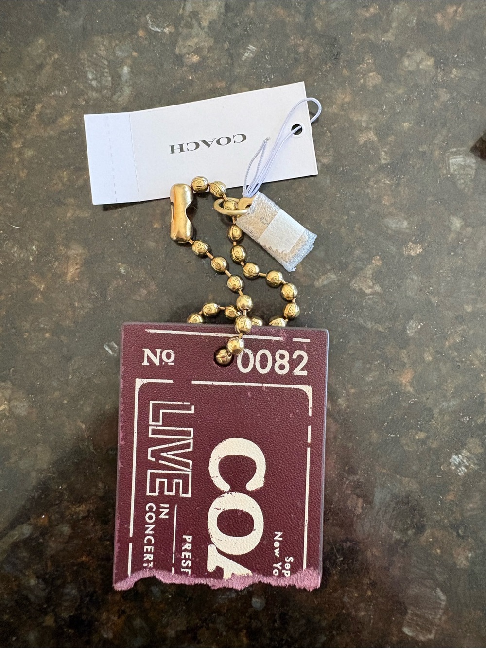 Coach ticket bag charm